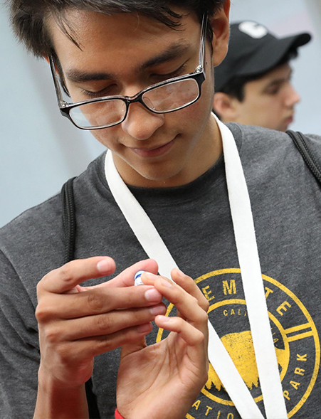 A male student observes a sensor