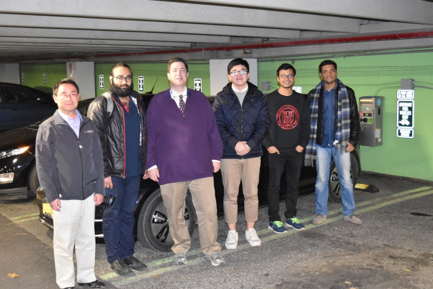 Student team visiting the EV charging facility in Hoy Road Garage at Cornell University